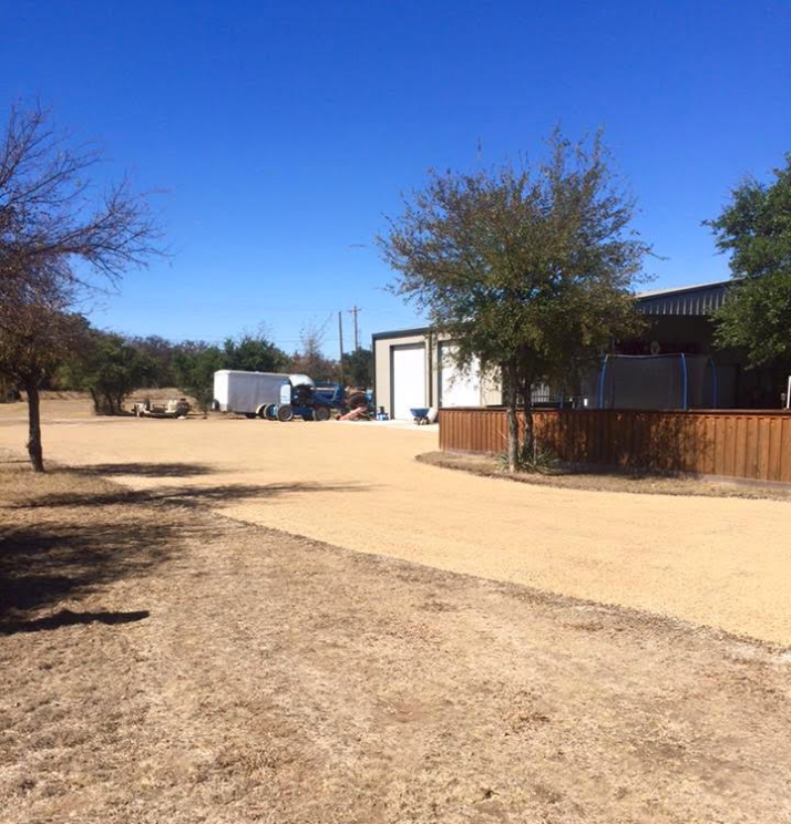 Chip sealed driveway and parking area under construction by Arrow Asphalt LLC.