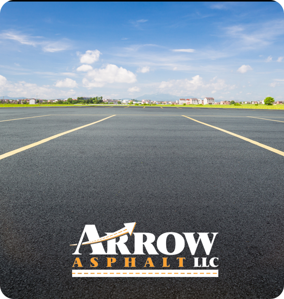 New asphalt parking lot and Arrow Asphalt LLC logo showcasing commercial paving services.