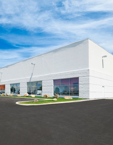 Distribution center building and asphalt paving for commercial properties.