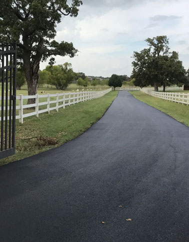 New asphalt driveway installation and residential paving project in Oklahoma.