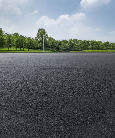 Newly paved asphalt parking lot and roadway in Oklahoma.