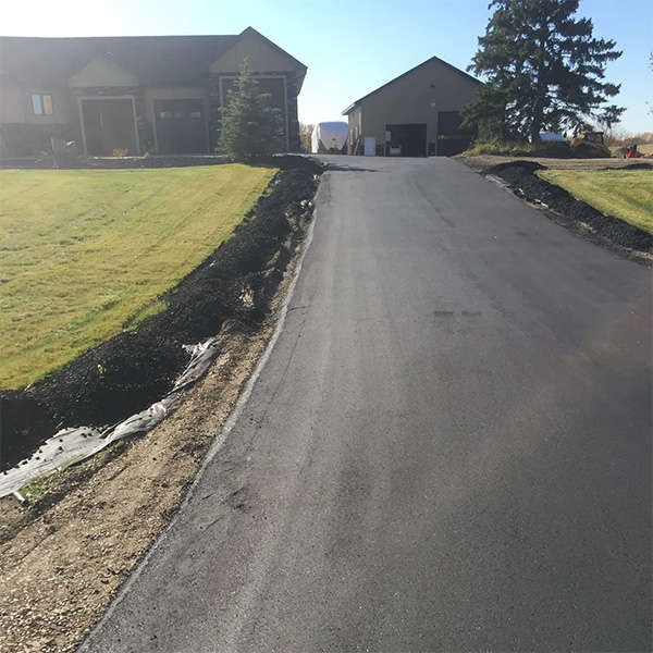 Newly paved asphalt driveway and garage in Shawnee, OK.